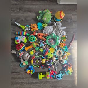 set 38 Colorful baby infant teethers, rattles and  Toys gently used some musical